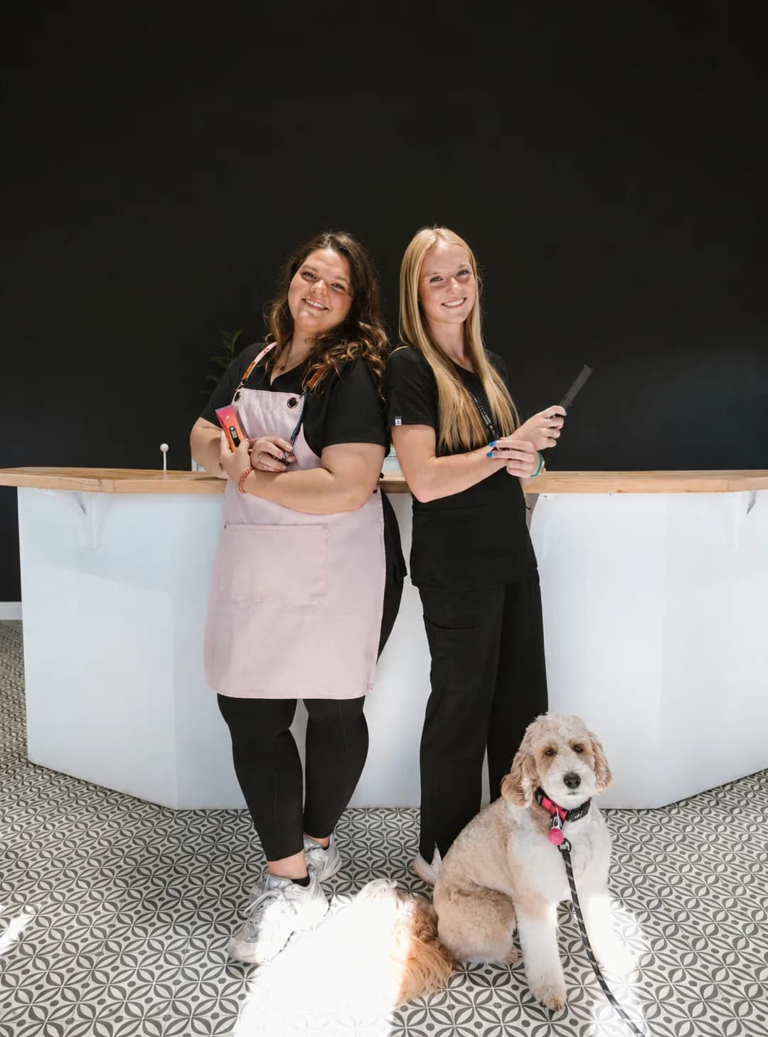 Nick and Rebecca Willis with a groomed doodle at Double U Grooming Co.